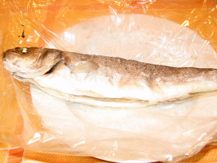 Baked sea bass baked in foil with paper fairy