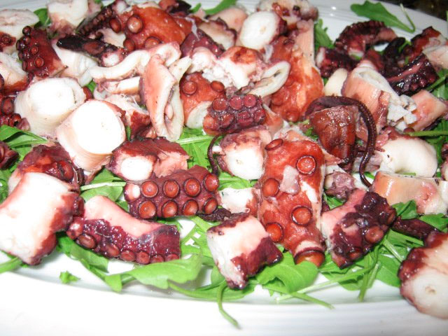 Octopus on a bed of arugula