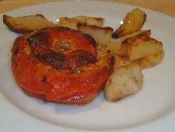 Stuffed tomatoes baked with potatoes